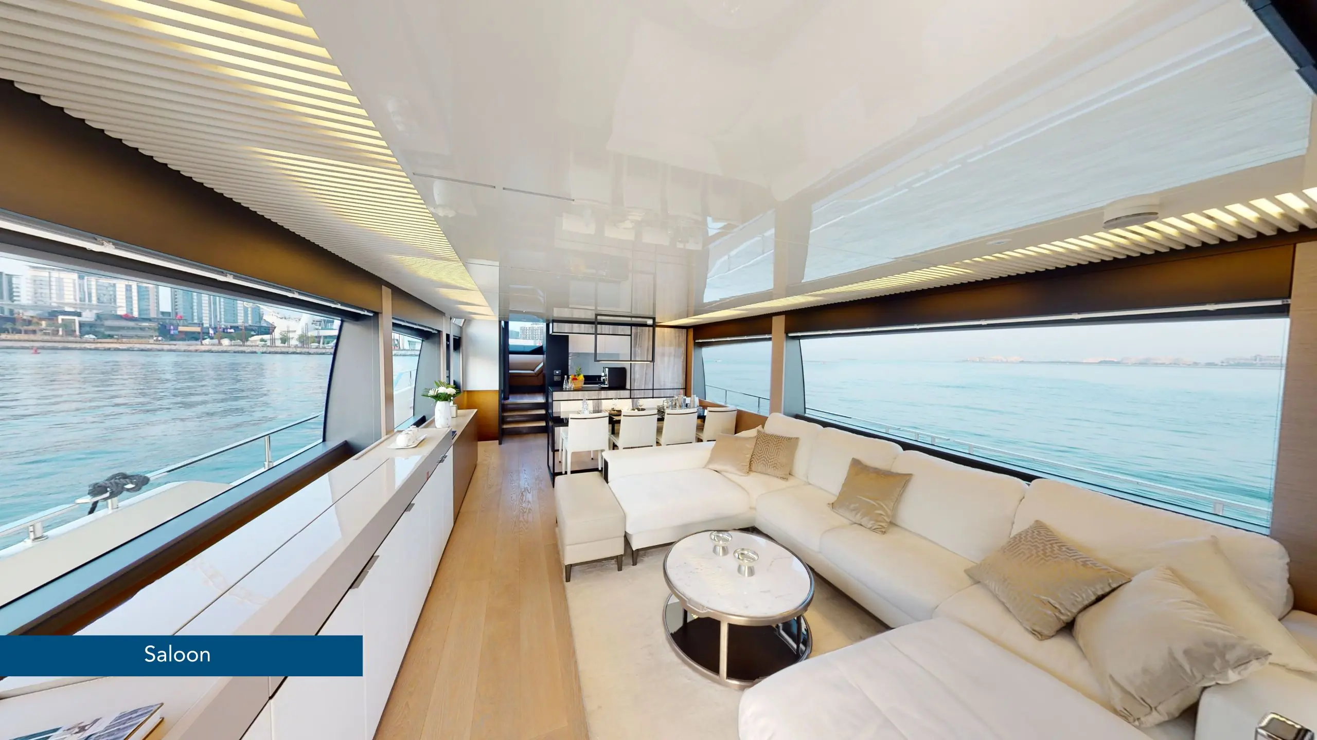 Luxury yacht cruising along the Dubai Marina during sunset