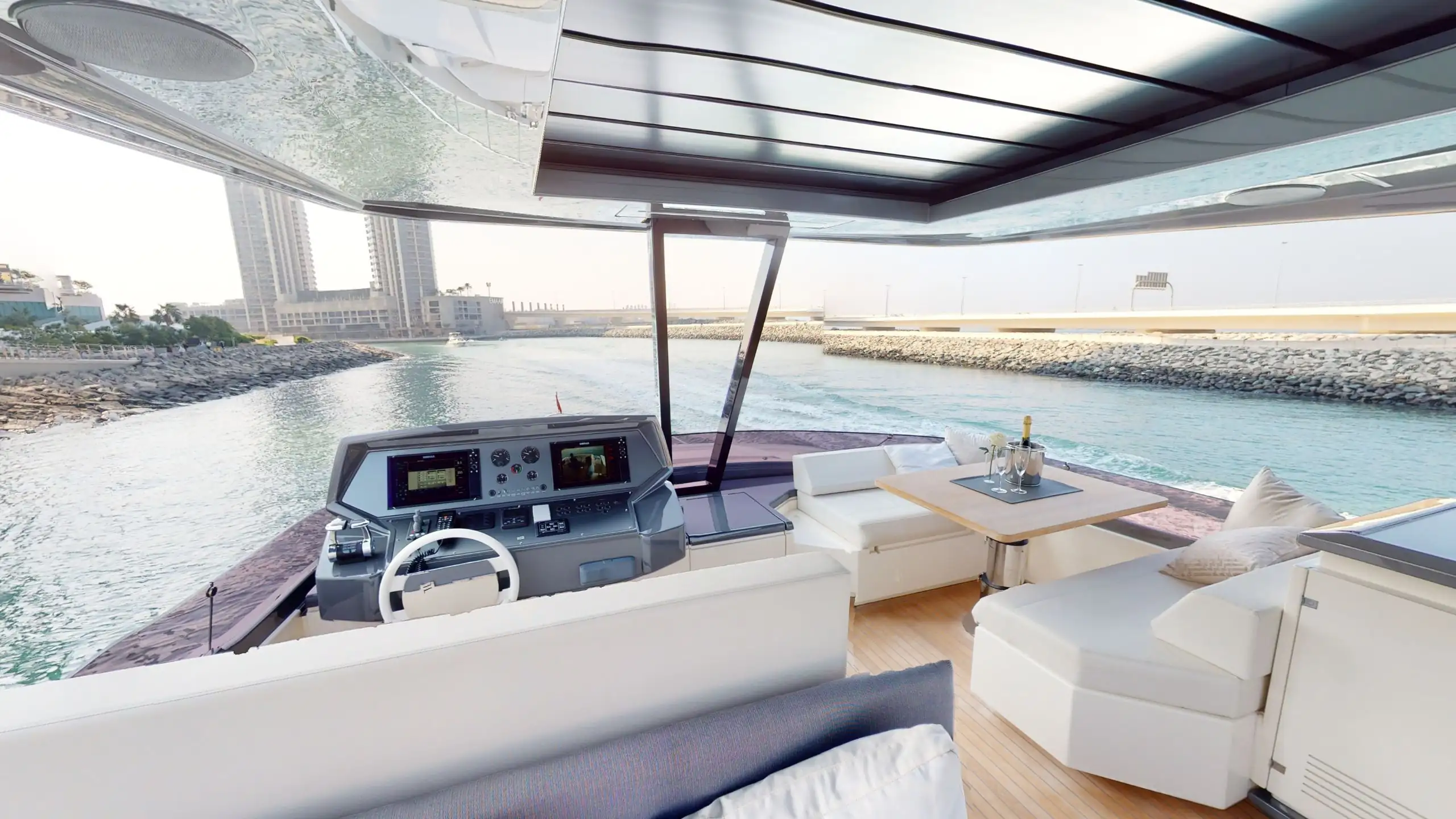 Group enjoying a yacht party in Dubai with Burj Al Arab in view
