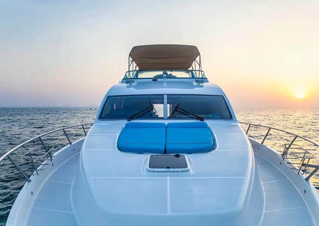 64 ft Blue Moon yacht sailing in Dubai Marina for private yacht rental